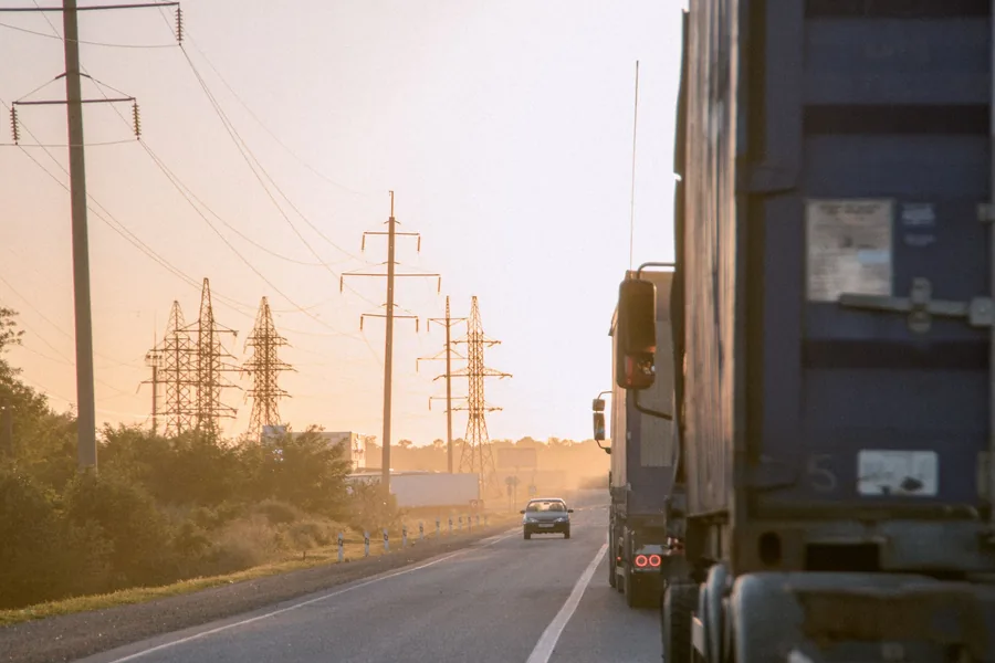 Illustrative stock photo: trucks on a road